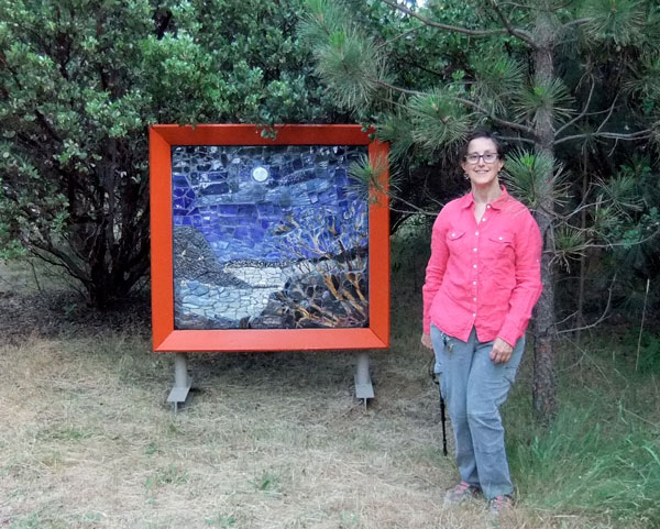 Artist Alicia Lee Farnsworth next to her Handmade Mosaic Landscape paying homage to the full moon over Clear Lake in Lake County California for 2013's EcoArts Sculpture Walk